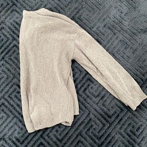 A grey, sweater top